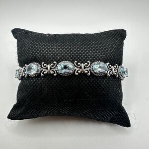 NWOT Stunning blue topaz and stamped sterling silver tennis bracelet!